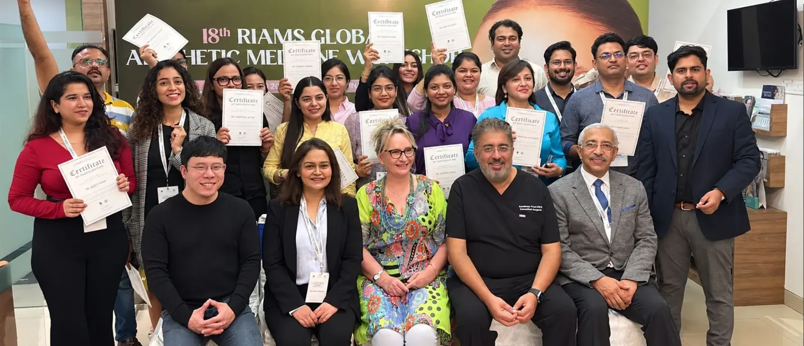 Doctors holding their certificates of participation with RIAMS faculty at the 18th RIAMS Global Aesthetic Medicine Workshop
